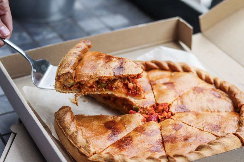 Pepperoni deep dish pizza with caramelized cheese edges