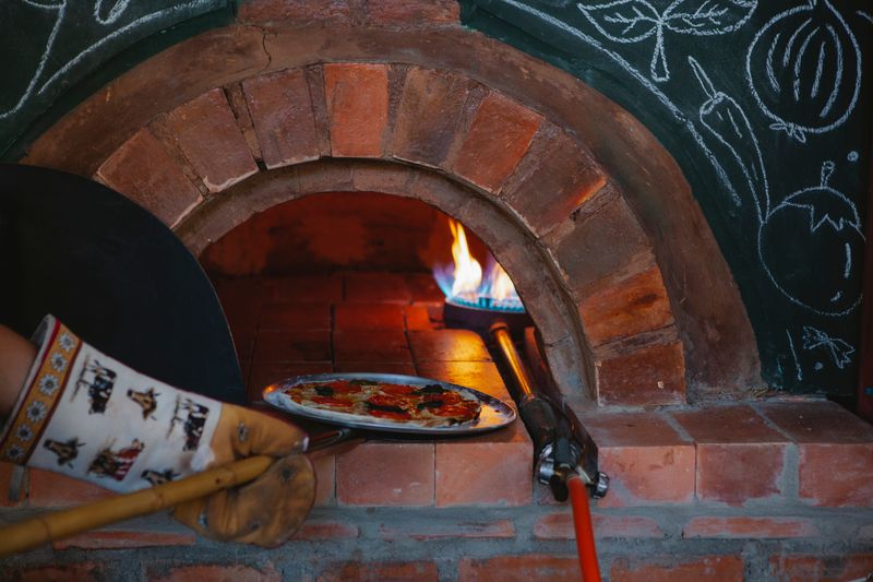 Cozy corner seating inside Pequod's pizza dining area