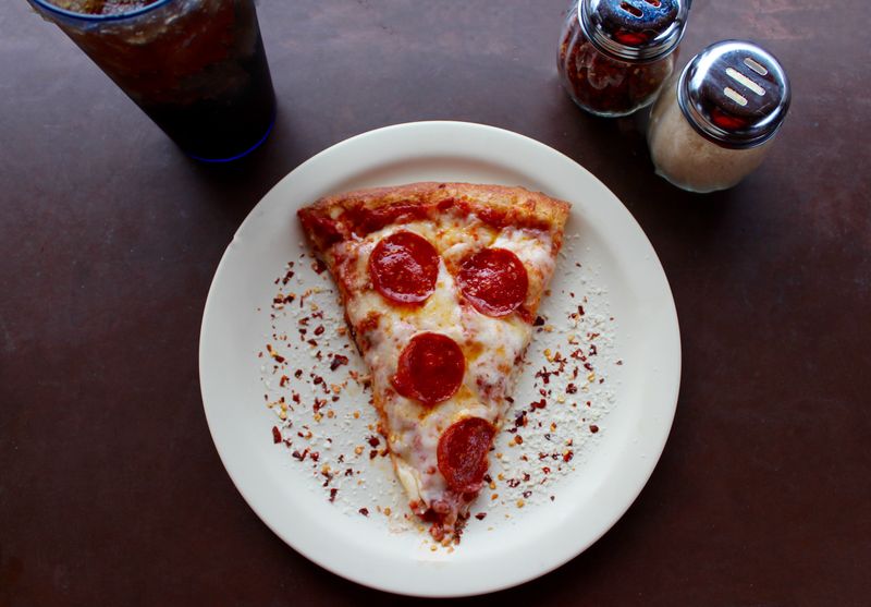 Spicy sausage thin crust pizza with fennel and chili